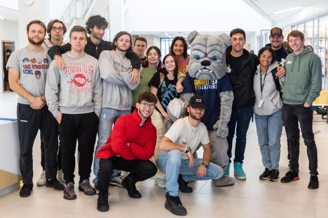 A group of Kettering students pose with the bulldog mascot in the Learning Commons